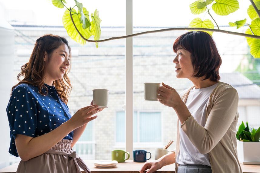 Mother and daughter drinking coffee