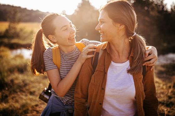 Mother and daughter walking outside